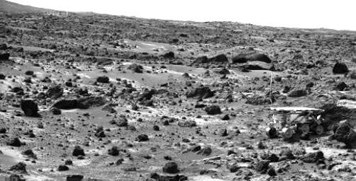 This image taken by NASA's Imager for Mars Pathfinder (IMP) on the morning of Sol 80 (September 23) shows the Sojourner rover with its Alpha Proton X-ray Spectrometer (APXS) deployed against the rock 'Chimp.' Sol 1 began on July 4, 1997.