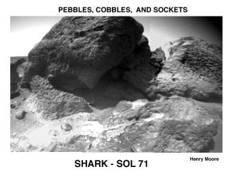 In 1997, NASA's Mars Pathfinder took this image of 'Shark' (upper left center), 'Half Dome' (upper right), and a small rock (right foreground) revealing textures and structures not visible in lander camera images.