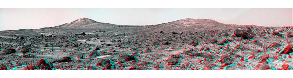 'Twin Peaks' are modest-size hills to the southwest of NASA's Mars Pathfinder landing site. They were discovered on the first panoramas taken by the IMP camera on the 4th of July, 1997. 3D glasses are necessary to identify surface detail. 