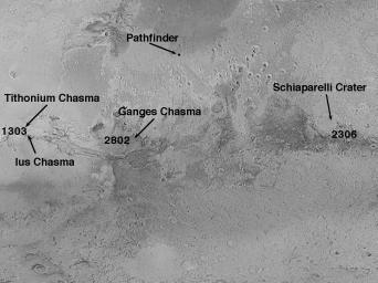 Low sunlight conditions and NASA's Mars Global Surveyor relative distance provide a low resolution view of the Tithonium/Ius Chasma, Ganges Chasma, and Schiaparelli Crater on Mars.