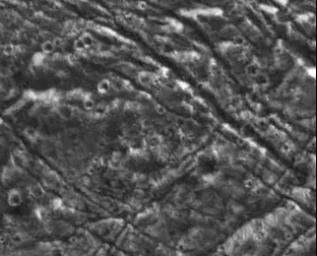 An ancient dark terrain surface is cut by orthogonal sets of fractures on Jupiter's moon Ganymede. This image of northern 
Marius Regio was obtained on September 6, 1996.