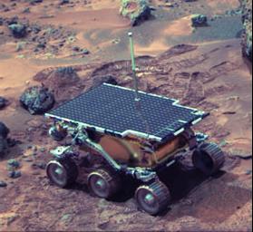 Lander image of NASA's Mars Pathfinder's rover Sojourner near 'The Dice' (three small rocks behind the rover) and 'Yogi' on sol 22, 1997.