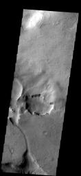 This closed depression is located in Noachis Terra on Mars. To the south a channel leads to second region of erosion. This image is from NASA's Mars Odyssey spacecrafft.