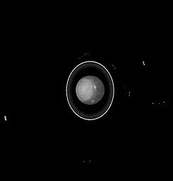 This NASA Hubble Space Telescope image of the planet Uranus reveals the planet's rings, at least five of the inner moons, and bright clouds in the planet's southern hemisphere. 