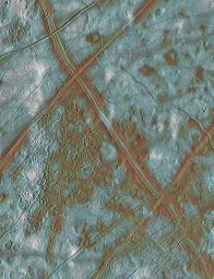This image of Jupiter's icy satellite Europa shows surface features such as domes and ridges, as well as a region of disrupted terrain including crustal plates which are thought to have broken apart and 'rafted' into new positions.