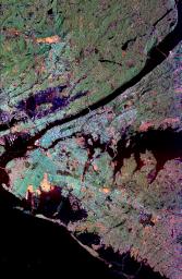This radar image of the New York city metropolitan area. The island of Manhattan appears in the center of the image. The green-colored rectangle on Manhattan is Central Park.