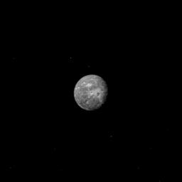 Uranus' outermost and largest moon, Oberon, is seen in this image, obtained by NASA's Voyager 2 on Jan. 22, 1986. Oberon displays several distinct highly reflective (high-albedo) patches with low-albedo centers.