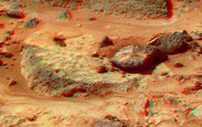 This anaglyph view of 'Flute Top' was produced by NASA's Mars Pathfinder's Imager camera. 3D glasses are necessary to identify surface detail.