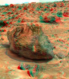 'Yogi' is a meter-size rock about 5 meters northwest of NASA's Mars Pathfinder lander and was the second rock visited by the Sojourner Rover's alpha proton X-ray spectrometer (APXS) instrument. 3D glasses are necessary to identify surface detail.