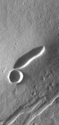 This image taken on August 22, 1998 by NASA's Mars Global Surveyor shows a small volcano is located in the Tempe-Mareotis Fossae region of Tempe Terra on Mars.