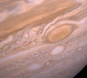 This image from NASA's Voyager 2 shows the region of Jupiter extending from the equator to the southern polar latitudes in the neighborhood of the Great Red Spot.
