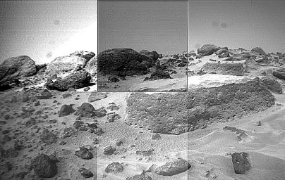 This image of the rock 'Flat Top' was taken from the left of NASA's Sojourner rover's front cameras on Sol 42. Pits on the edge of the rock and a fluted surface are clearly visible. The rocks in the left background comprise the Rock Garden.