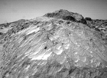 A close-up view of the rock 'Moe' in the 'Rock Garden' at the Pathfinder landing site. Moe is a meter-size boulder that, as seen by NASA's Sojourner, has a relatively smooth yet pitted texture upon close examination. Sol 1 began on July 4, 1997.
