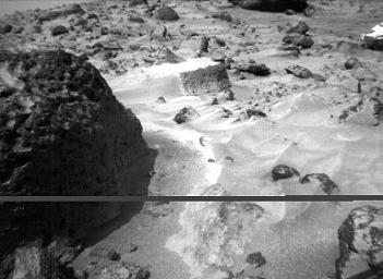 The rock 'Stimpy' is seen in this close-up image taken by NASA's Sojourner rover's right front camera on Sol 70 (September 13). Detailed texture on the rock, such as pits and flutes, are clearly visible. Sol 1 began on July 4, 1997.