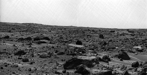 Noontime on Sol 75 (September 18). The rover's middle right wheel is raised above the surface. Sojourner is over 12 m from the lander, a mission record. The image was taken by NASA's Imager for Mars Pathfinder (IMP). Sol 1 began on July 4, 1997.