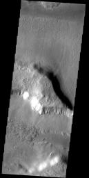 The martian region called Deuteronilus is characterized by hills and mesas surrounded by broad debris slopes. Some of the slopes have surface markings are mixed in with the debris as seen by NASA's Mars Odyssey spacecraft.