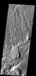 Tectonic activity in this region has not only fractured the surface, but has tilted some of the fracture blocks on Mars as seen by NASA's Mars Odyssey spacecraft.