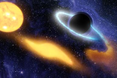 This artist's concept shows a supermassive black hole at the center of a remote galaxy digesting the remnants of a star.