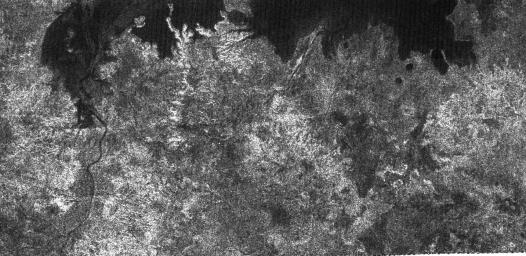 The large dark patch seen on this image at high latitudes surrounding Titan's north pole, is from NASA's Cassini spacecraft's radar system, and most likely a hydrocarbon lake.