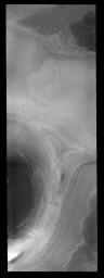 This image shows half of a crater on the polar cap of Mars as seen by NASA's 2001 Mars Odyssey spacecraft.