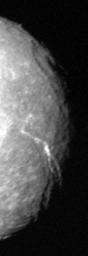 The terminator region of Titania, one of Uranus' five large moons, was captured in this Voyager 2 image obtained in the early morning hours of Jan. 24, 1986.
