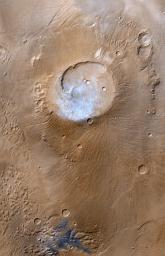 NASA's Mars Global Surveyor passed over the Apollinaris Patera volcano and captured a patch of bright clouds hanging over its summit in the early martian afternoon during the month of April 1999.