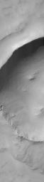 NASA's Mars Global Surveyor shows a crater located in south-central Syria Planum on Mars. This crater was formed by the impact and explosion of a meteorite at some time in the martian past.