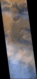 NASA's Mars Global Surveyor shows a dust storm between eastern Ius Chasma and western Melas Chasma on Mars.