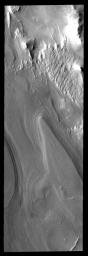 This image from NASA's 2001 Mars Odyssey is of the south polar region on Mars shows layered material. It is not known if the layers are formed yearly or if they form over the period of 10s to 100s of years or more.