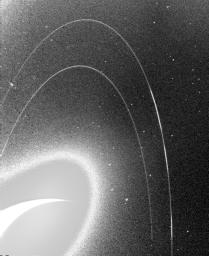This wide-angle image from NASA's Voyager 2, taken in 1989, was taken through the camera's clear filter, and was the first to show Neptune's rings in detail.