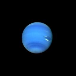 This contrast enhanced color picture of Neptune was acquired by NASA's Voyager 2 on Aug. 14, 1989. As Voyager 2 approached Neptune, rapidly increasing image resolution is revealed striking new details. Bright, wispy clouds are seen overlying the Great Dar