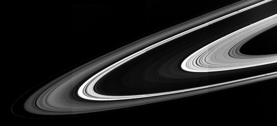 When seen from the unlit side, the rings of Saturn present a much different appearance from that familiar to telescopic observers, as shown in this image captured by NASA's Voyager 1.