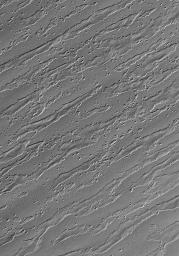 This image from NASA's Mars Global Surveyor image shows the remains of a once more laterally extensive layer overlying undulating terrain very near the south polar residual cap on Mars.