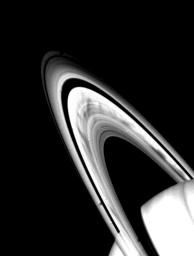 Prominent dark spokes are visible in the outer half of Saturn's broad B-ring in this NASA Voyager 2 photograph taken on Aug. 3, 1981 from a range of about 22 million kilometers (14 million miles).