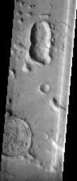 This image contains several different impact craters on Mars as seen by NASA's 2001 Mars Odyssey spacecraft.