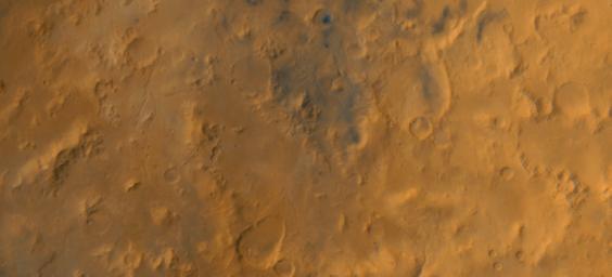 NASA's Mars Global Surveyor shows the Libya Montes, a ring of mountains up-lifted by the giant impact that created the Isidis basin to the north on Mars.