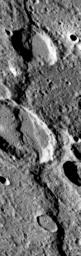 NASA's Mariner 10 spacecraft was coaxed into a third and final encounter with Mercury in March of 1975. This is one of the highest resolution images of Mercury acquired by the spacecraft. The prominent scarp snaking up the image was named Discovery Rupes.