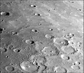 This photograph of Mercury was taken by NASA's Mariner 10 spacecraft shows smooth plains areas on Mercury that are thought to be volcanic in origin with lava flows filling in heavily cratered areas.
