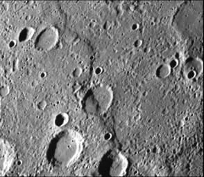 Intercrater plains and heavily cratered terrain typical of much of Mercury outside the area affected by the formation of the Caloris basin are shown in this image taken during the NASA's Mariner 10's first encounter with Mercury in 1974.