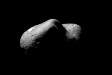 This image of Eros, taken on Feb 14, 2000 by NASA's NEAR Shoemaker spacecraft, shows the view looking from one end of the asteroid across the gouge on its underside and toward the opposite end. House-sized boulders are present in several places.