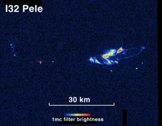 In this view from NASA's Galileo spacecraft in 2001, the Pele hot spot on Jupiter's moon Io shows a complex pattern of areas glowing in the dark, including areas likely to be fresh overturning of a lava lake's crust.