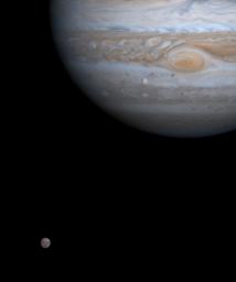 One moment in an ancient, orbital dance is caught in this color picture taken by NASA's Cassini spacecraft on Dec. 7, 2000, just as two of Jupiter's four major moons, Europa and Callisto, were nearly perfectly aligned with each other.