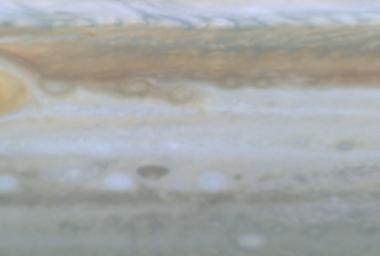 This image is a still frame, created from images taken by NASA's Cassini spacecraft, shows small spots slipping over each other east of Jupiter's Great Red Spot. 