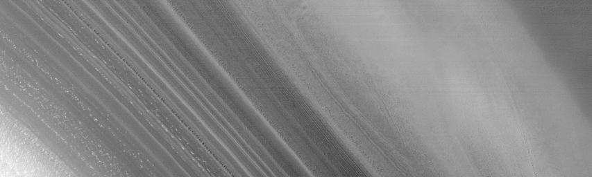 NASA's Mars Global Surveyor shows many layers exposed and eroded into the form of ridges and troughs on shallow slopes within the martian north polar cap.