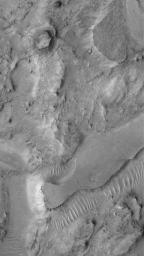 NASA's Mars Global Surveyor shows mesas and other eroded landforms in eastern Arabia Terra, near Huo Hsing Vallis on Mars. Arabia Terra is generally a cratered terrain that has been severely eroded.