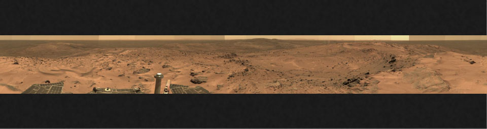 This image from NASA's Mars Exploration Rover Spirit taken in Oct 2005 show a sweeping panorama of the summit of 'Husband Hill,' a broad plateau of rock outcrops and windblown drifts.