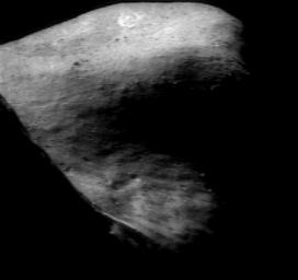 This image of asteroid Eros taken on Nov. 24, 2000, by NASA's NEAR Shoemaker shows the shadowed high terrain east of the saddle.