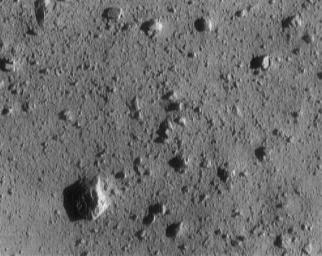 This image of asteroid 433 Eros, taken by NASA's NEAR Shoemaker shows a large rock at lower left on the surface.