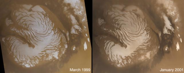 NASA's Mars Global Surveyor shows light-toned surfaces of residual water ice in summer on Mars' north polar cap.