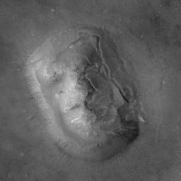 NASA's Mars Global Surveyor shows thousands of buttes, mesas, ridges, and knobs in the transition zone between the cratered uplands of western Arabia Terra and the low, northern plains of Mars.